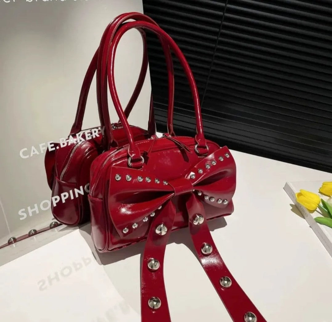 (Free Shipping)(Tariffs included in price) Women's Rivet Bolsos Mujer Motorcycle Bow Bag Underarm Shoulder Bags American Style Sac Femme New Adjustable Strap Bolso