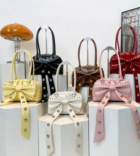 (Free Shipping)(Tariffs included in price) Women's Rivet Bolsos Mujer Motorcycle Bow Bag Underarm Shoulder Bags American Style Sac Femme New Adjustable Strap Bolso